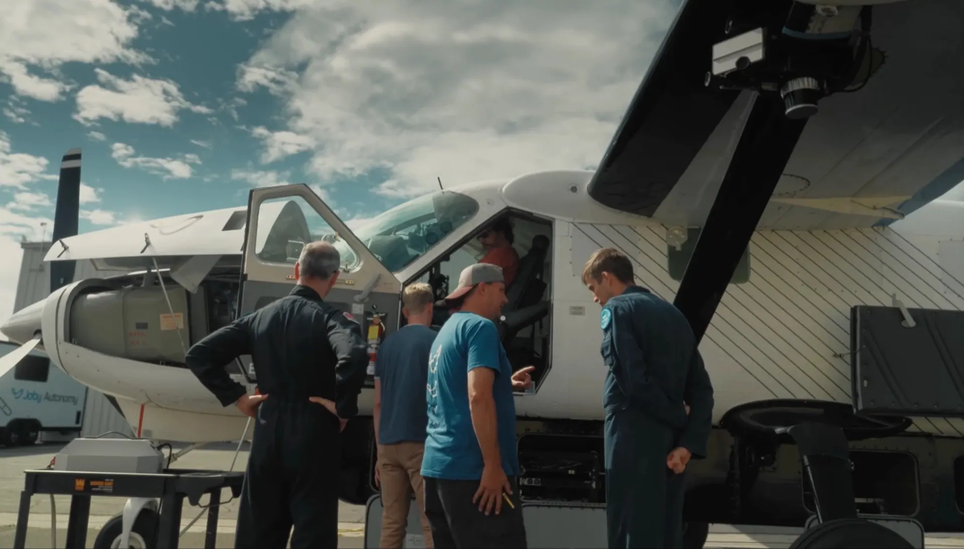 Crew gathered at the open door of Joby's Recon aircraft